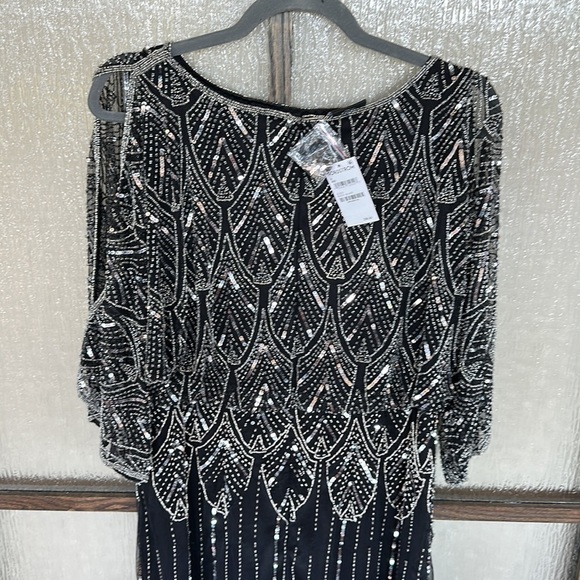 Pisarro Nights
Pisarro Nights Cold Shoulder Short Sleeve Gown Black/silver Sz 4 - Picture 9 of 13